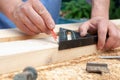 carpenter taking measurements on a board Royalty Free Stock Photo