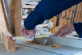 Carpenter taking measurments at the table saw. Royalty Free Stock Photo