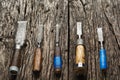 Carpenter tools composition. Old carpenter chisels laying on rustic wooden table upper view Royalty Free Stock Photo