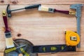 Carpenter tools on wood board Royalty Free Stock Photo