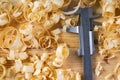 Carpenter tools on wood table background with sawdust. Copy space