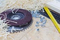 Carpenter tools on wooden table with sawdust. Circular Saw. Carpenter workplace top view Royalty Free Stock Photo