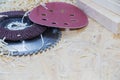 Carpenter tools on wooden table with sawdust. Circular Saw. Carpenter workplace top view. Royalty Free Stock Photo