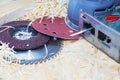 Carpenter tools on wooden table with sawdust. Circular Saw. Carpenter workplace top view. Royalty Free Stock Photo