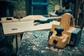 Carpenter plane at workbench Royalty Free Stock Photo