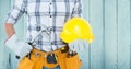 Carpenter torso with hammer against blue wood panel Royalty Free Stock Photo