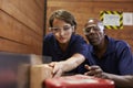 Carpenter Training Female Apprentice To Use Plane Royalty Free Stock Photo