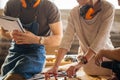 Carpenter Training Female Apprentice To Use Plane Royalty Free Stock Photo