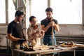 Carpenter Training Female Apprentice To Use Plane Royalty Free Stock Photo