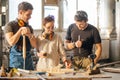 Carpenter Training Female Apprentice To Use Plane Royalty Free Stock Photo