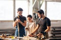 Carpenter Training Female Apprentice To Use Plane Royalty Free Stock Photo