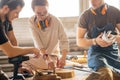 Carpenter Training Female Apprentice To Use Plane Royalty Free Stock Photo