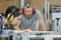 carpenter training female apprentice in workshop Royalty Free Stock Photo