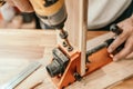 Carpenter use drill bit Pocket hole joinery, or pocket screw joinery, involves drilling a hole at an angle ,make strong joints on Royalty Free Stock Photo