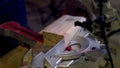 Carpenter uses Circular Saw with laser Cutting wooden beams. Close-up Royalty Free Stock Photo