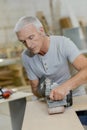 Carpenter using belt sander Royalty Free Stock Photo