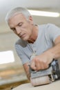 Carpenter using belt sander Royalty Free Stock Photo