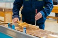 Carpenter using chisel and hammer to carve wood - close up Royalty Free Stock Photo