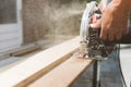 Carpenter using circular power saw for cutting wood, home improvement, do it yourself DIY and construction works concept Royalty Free Stock Photo