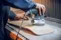 Carpenter using circular saw for cutting wooden boards. Royalty Free Stock Photo