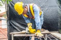 Carpenter using circular saw for cutting wooden boards with power tools, construction and home renovation, repair and construction Royalty Free Stock Photo