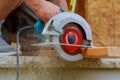 Circular Saw. Carpenter Using Circular Saw for wood beam Royalty Free Stock Photo