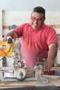 Carpenter using a circular saw in the workshop Royalty Free Stock Photo
