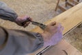 Carpenter using grinder on wood