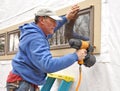 Carpenter using nail gun