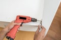 Carpenter using Screwdriver assemble furniture Royalty Free Stock Photo