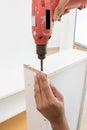 Carpenter using Screwdriver assemble furniture Royalty Free Stock Photo