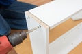 Carpenter using Screwdriver assemble furniture Royalty Free Stock Photo