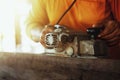 Carpenter is using tools to clear the wood, straighten the wood Royalty Free Stock Photo