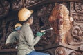 Carpenter - wood carving master performs artistic wood carving with special tools. Thailand, Pattaya 2019-12-25