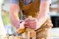Carpenter with wood planer and workpiece in carpentry Royalty Free Stock Photo