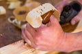 Carpenter with wood planer and workpiece in carpentry Royalty Free Stock Photo