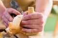 Carpenter with wood planer and workpiece in carpentry Royalty Free Stock Photo