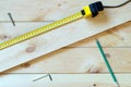 Carpenter work concept. Measuring tape on table. Royalty Free Stock Photo