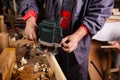 Carpenter at work with electric planer joinery Royalty Free Stock Photo