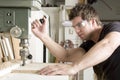 Carpenter at work on job using power tool Royalty Free Stock Photo