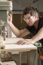 Carpenter at work on job using power tool Royalty Free Stock Photo