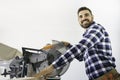 Carpenter at work on job using power tool Royalty Free Stock Photo