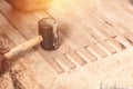 Carpenter on work laying laminate or parquet flooring use a rubber mallet, applied adhesive for parquet. Home renovation, Close up