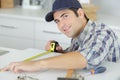 Carpenter at work measures with tape measure Royalty Free Stock Photo