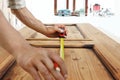 Carpenter at work measures with the tape measure and pencil on w Royalty Free Stock Photo