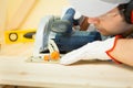 Carpenter at work using a circular saw Royalty Free Stock Photo