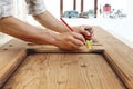 Carpenter work the wood, measuring a wooden vintage door Royalty Free Stock Photo