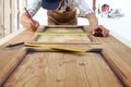 Carpenter work the wood, measuring a wooden vintage door Royalty Free Stock Photo