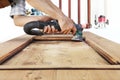 Carpenter work the wood with the sander Royalty Free Stock Photo