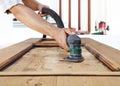 Carpenter work the wood with the sander Royalty Free Stock Photo